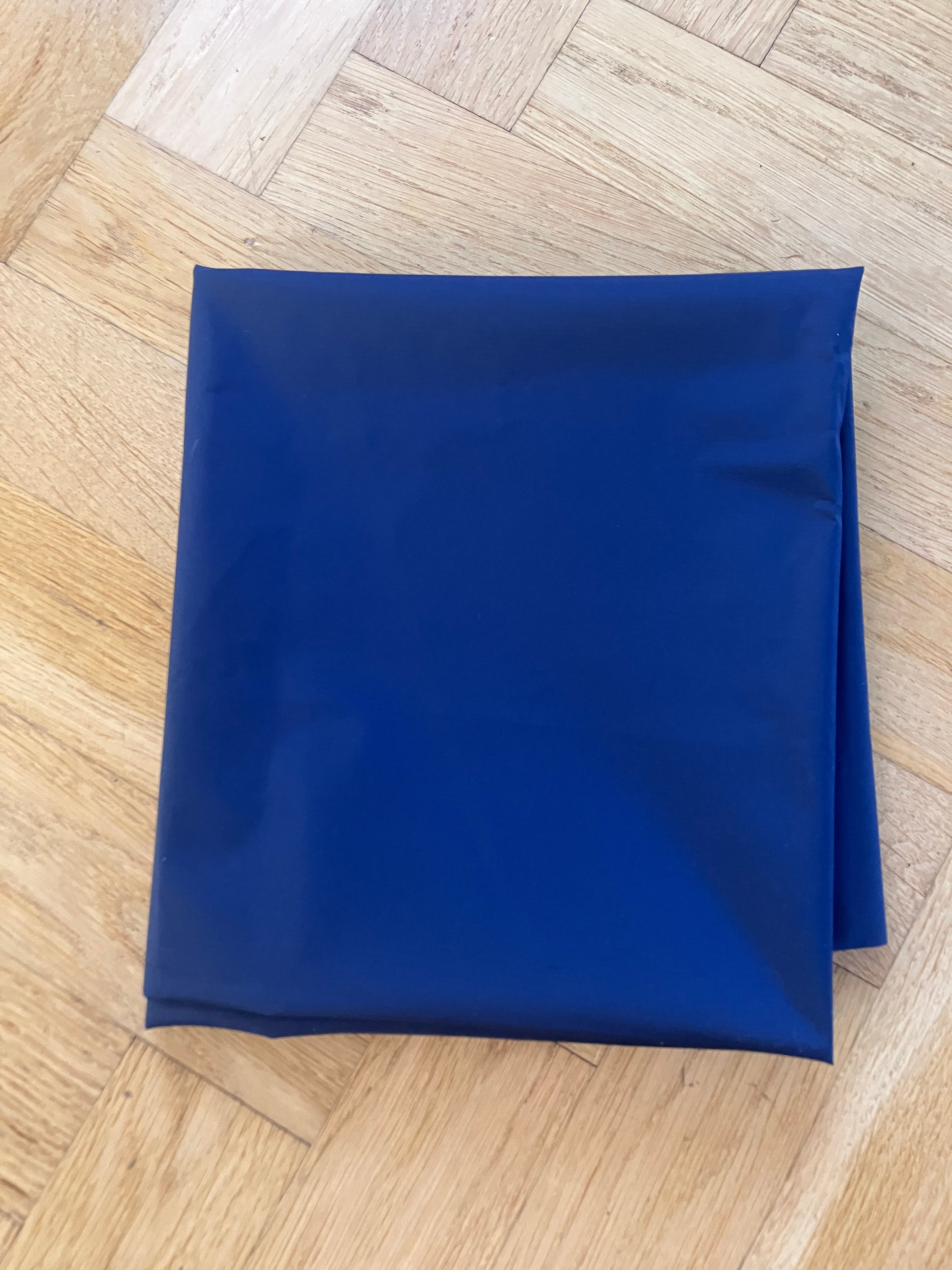 Blue fabric square on a wooden floor