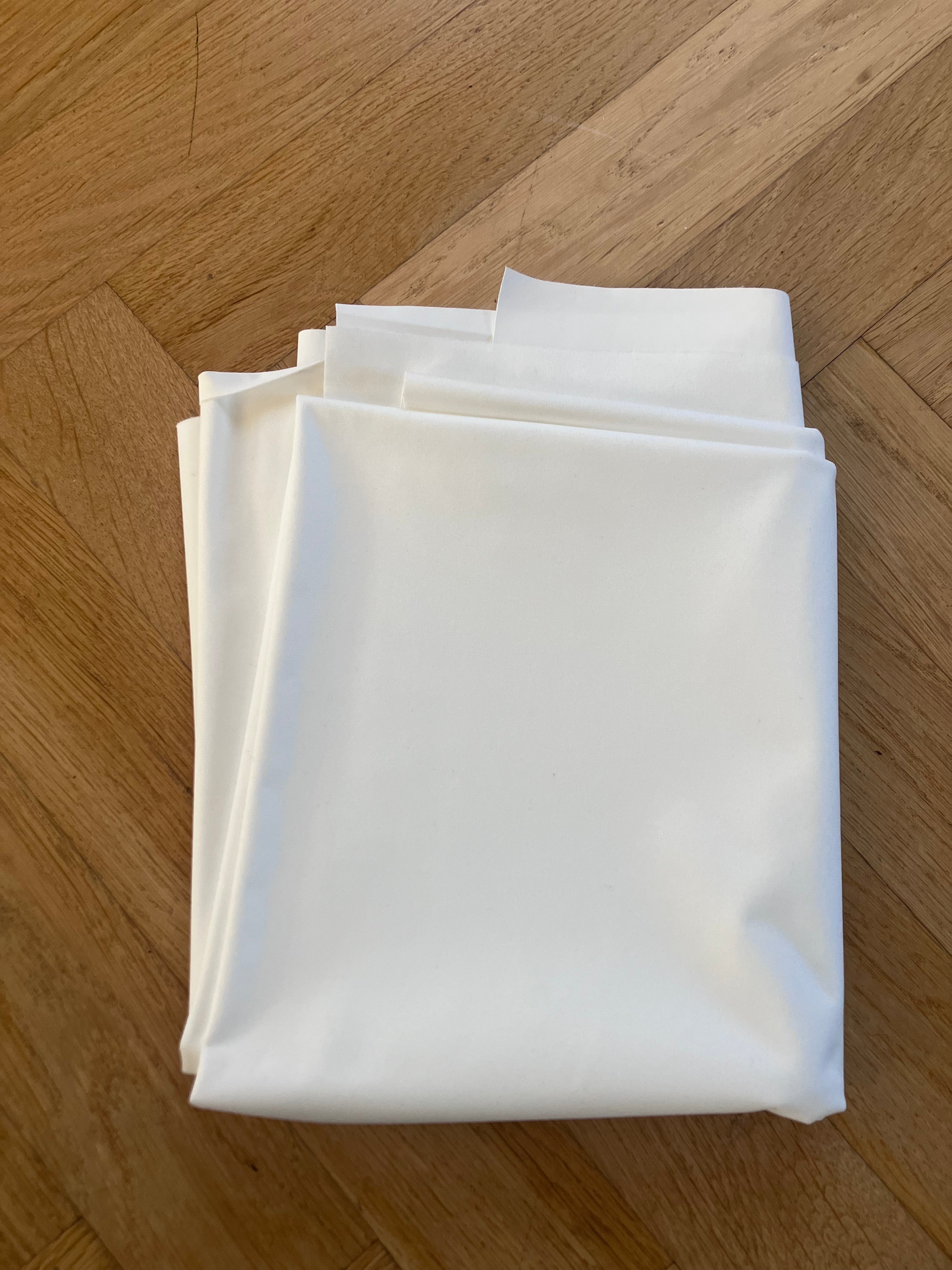 Stack of white paper on a wooden surface